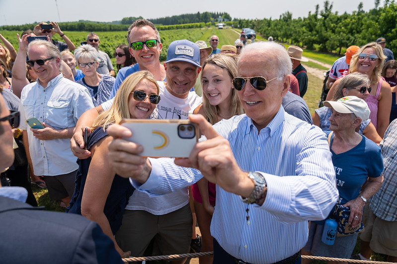 President Joe Biden poses for photos with guests during his tour of King Orchards, Saturday, July 3, 2021, in Central Lake, Michigan. (Official White House Photo by Adam Schultz)